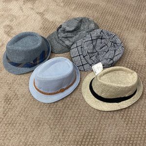 Lot of hats. Fedora and winter. As is (pictured). One is brand new never worn.